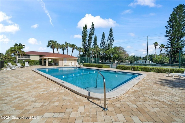 view of swimming pool featuring a patio