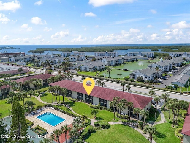 birds eye view of property with a water view