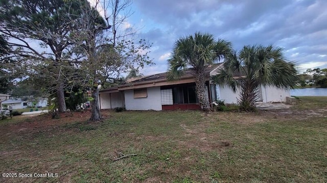 exterior space with a lawn