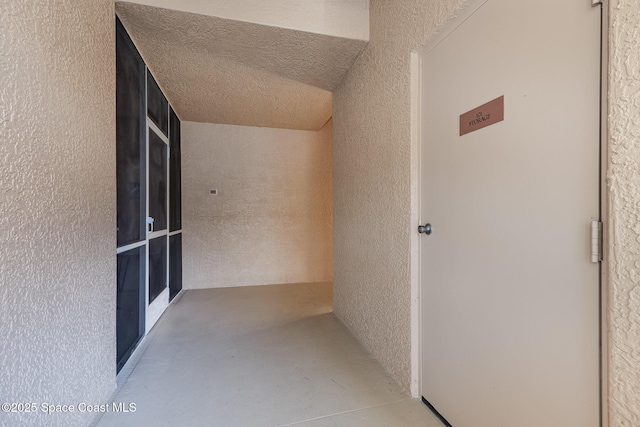 hallway featuring concrete floors