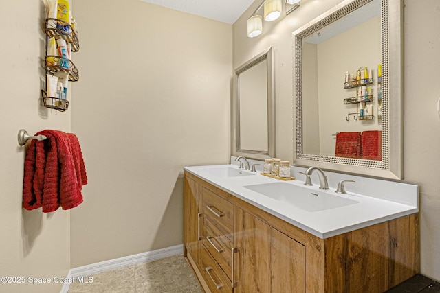 bathroom featuring tile patterned flooring and vanity