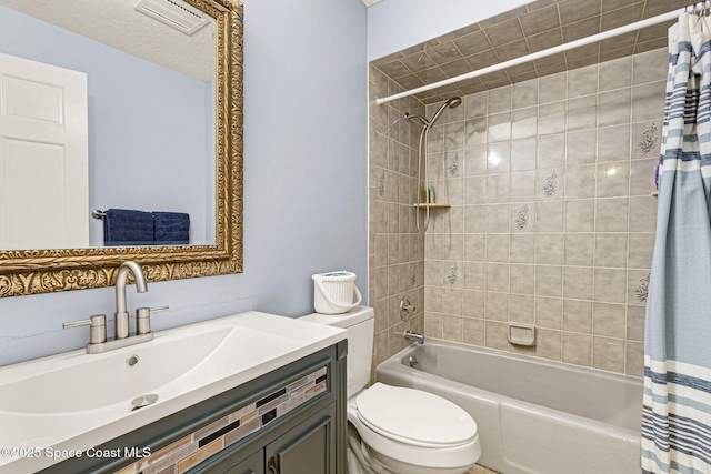 full bathroom with shower / bath combo, vanity, and toilet