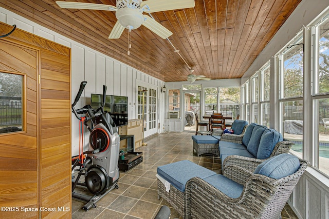 sunroom / solarium with wooden ceiling and ceiling fan