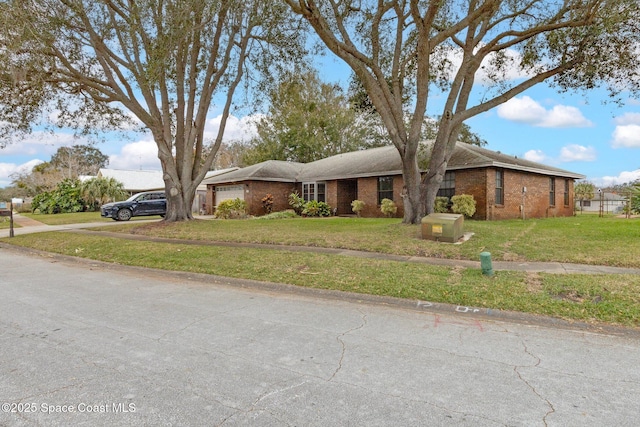 view of front of home with a garage and a front yard