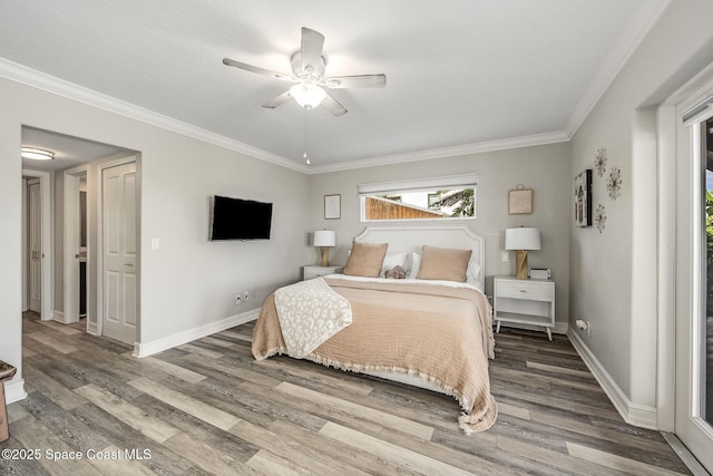 bedroom with ceiling fan, wood-type flooring, and crown molding