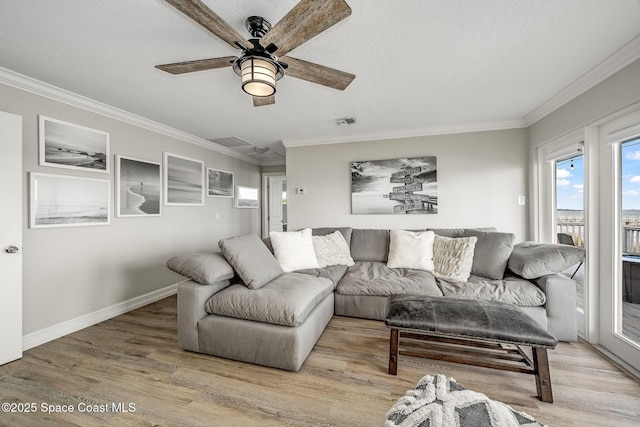 living room featuring light wood-type flooring, ceiling fan, and ornamental molding