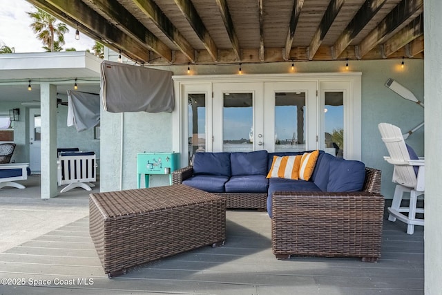 view of patio / terrace featuring a deck, an outdoor hangout area, and french doors