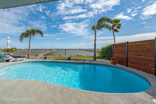 view of pool featuring a water view