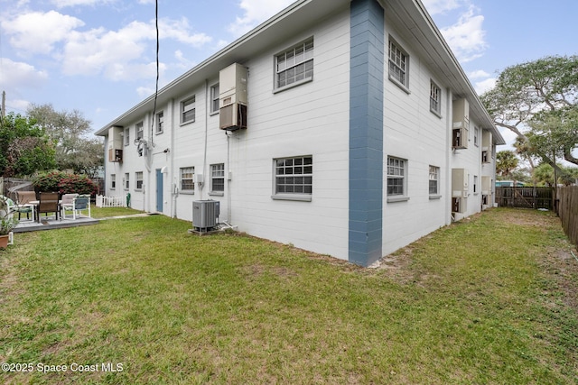 405 Adams Ave Unit 10, Cape Canaveral, FL 32920 - back of house with a fenced backyard and a patio