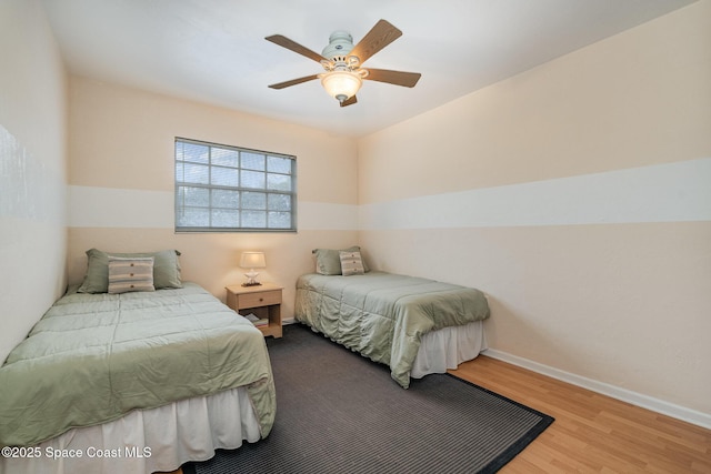 405 Adams Ave Unit 10, Cape Canaveral, FL 32920 - bedroom with wood finished floors and a ceiling fan