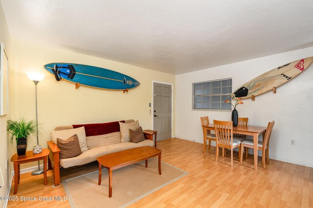 405 Adams Ave Unit 10, Cape Canaveral, FL 32920 - living area with light wood-style floors and baseboards