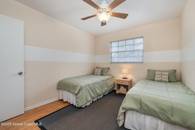 405 Adams Ave Unit 10, Cape Canaveral, FL 32920 - bedroom featuring wood finished floors and a ceiling fan