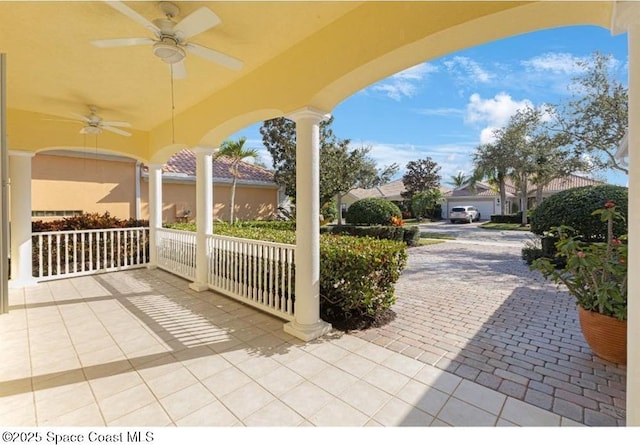 view of patio featuring ceiling fan and covered porch