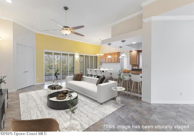 living room featuring ceiling fan and ornamental molding