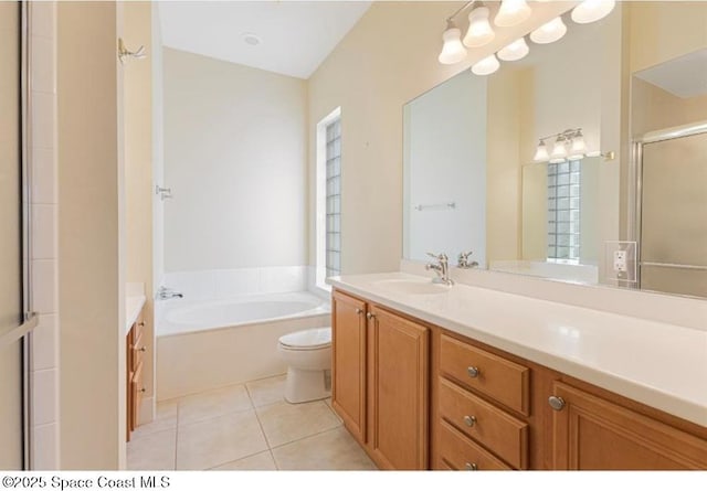 full bathroom featuring toilet, vanity, tile patterned floors, and plus walk in shower