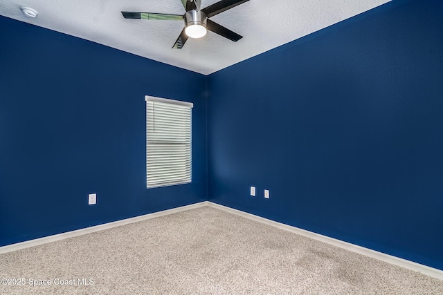 unfurnished room featuring ceiling fan, carpet floors, and a textured ceiling