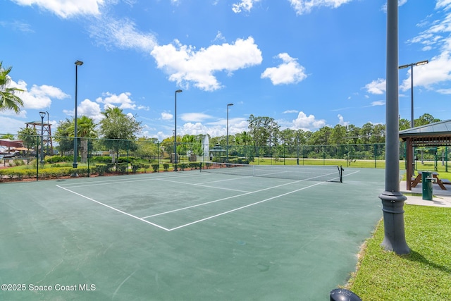 view of tennis court with a gazebo