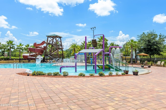 view of pool with a playground