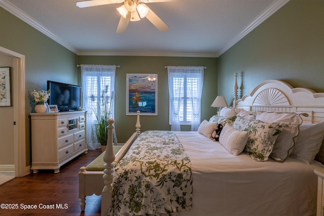 bedroom featuring ceiling fan, crown molding, dark wood-type flooring, and multiple windows