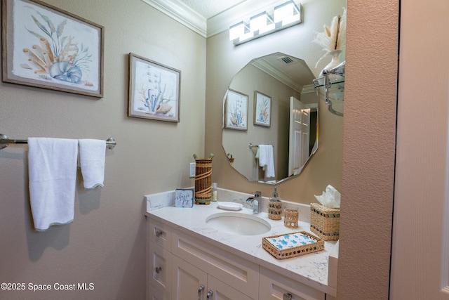 bathroom featuring vanity and ornamental molding