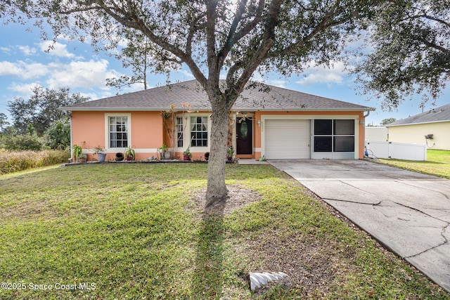 ranch-style house featuring a front yard and a garage