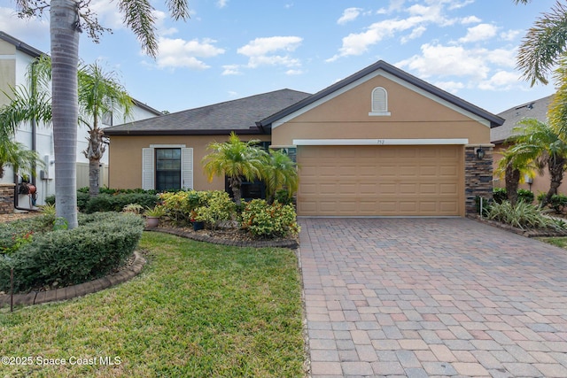 ranch-style home with a garage and a front yard