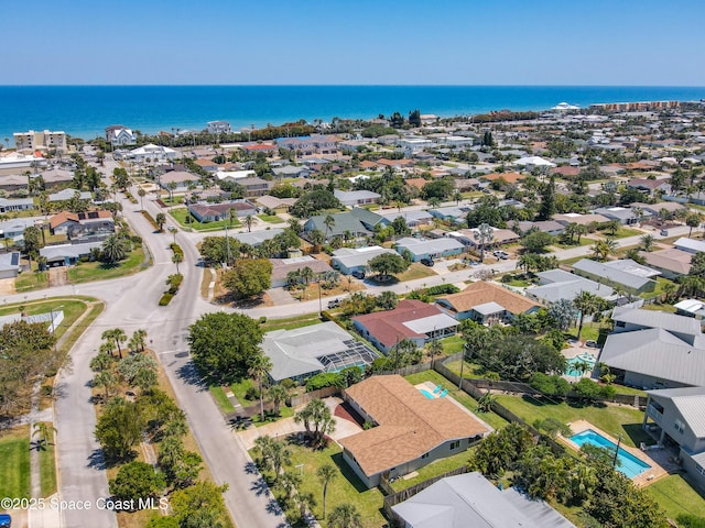 bird's eye view featuring a residential view and a water view