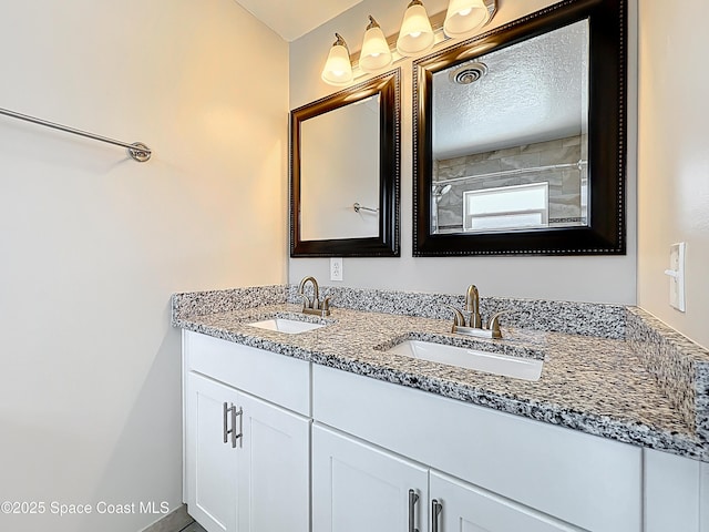 bathroom with double vanity and a sink