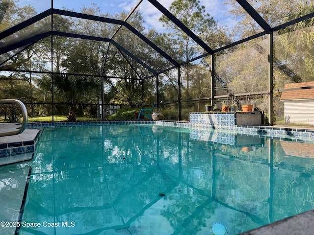 view of swimming pool with glass enclosure