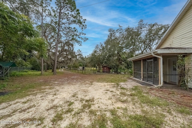 view of yard featuring a sunroom