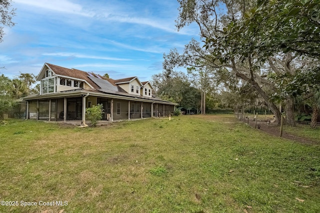 view of yard featuring a sunroom