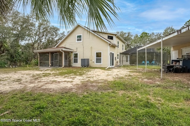 rear view of house featuring a lanai, a pool, central AC, and a sunroom