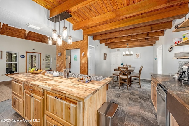 kitchen with a chandelier, wood counters, decorative light fixtures, and beamed ceiling