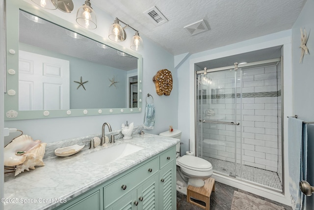 bathroom featuring toilet, an enclosed shower, vanity, and a textured ceiling