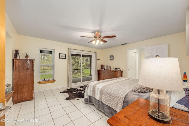 tiled bedroom with ceiling fan