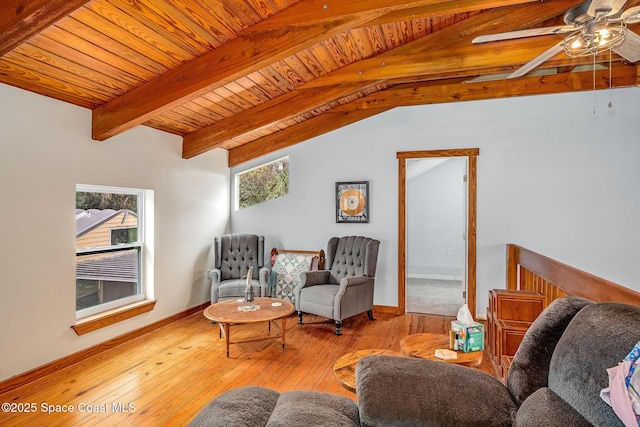 living room with light hardwood / wood-style floors, ceiling fan, and lofted ceiling with beams