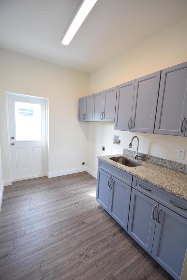 kitchen with dark hardwood / wood-style floors and sink