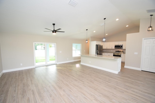 unfurnished living room featuring ceiling fan, light hardwood / wood-style flooring, high vaulted ceiling, and sink