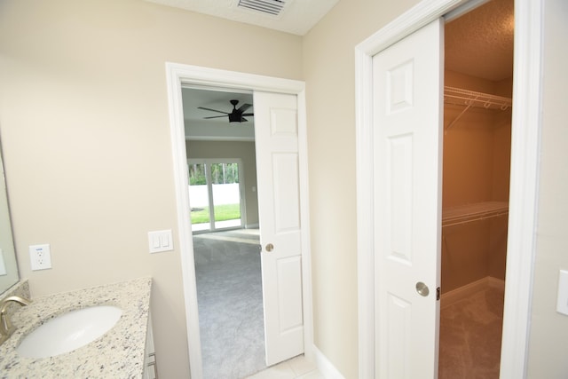 bathroom with tile patterned floors and vanity