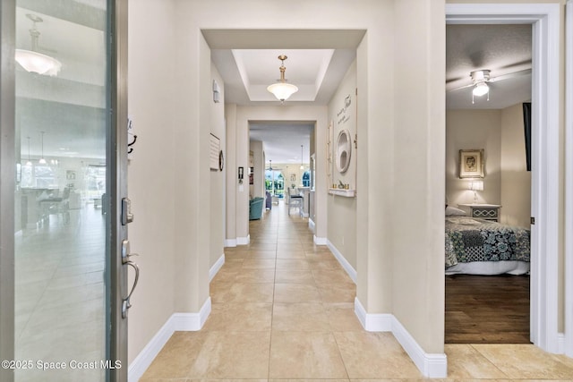 corridor with light tile patterned floors