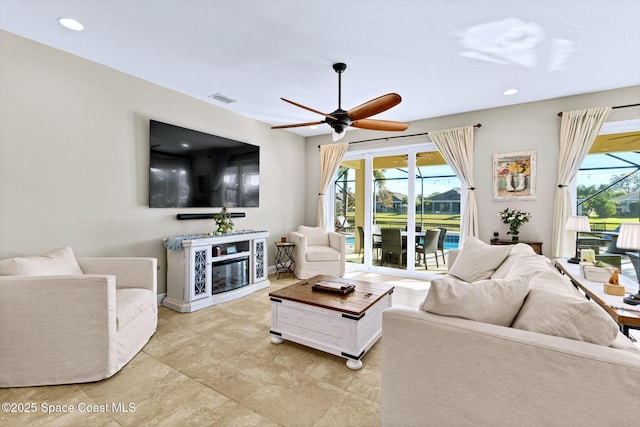 living room with ceiling fan