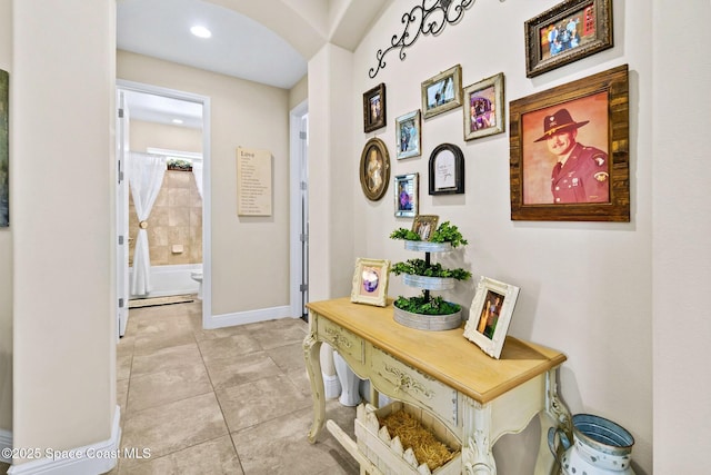 hall with light tile patterned flooring