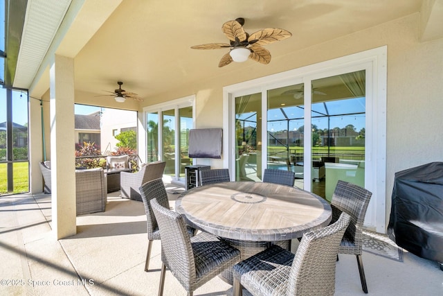 view of patio with a lanai and ceiling fan