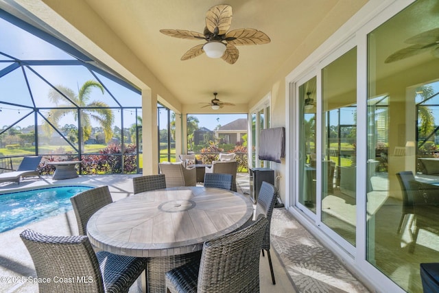 sunroom / solarium with ceiling fan