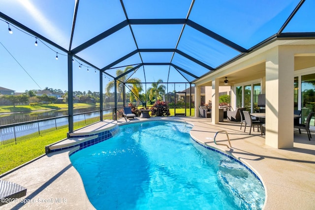 view of pool featuring a lanai, a water view, ceiling fan, and a patio area