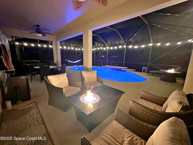 view of pool featuring ceiling fan, an outdoor living space with a fire pit, a jacuzzi, and a patio