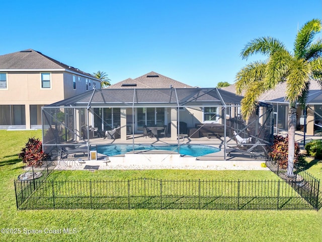 back of house with a patio, a fenced in pool, a lanai, and a lawn