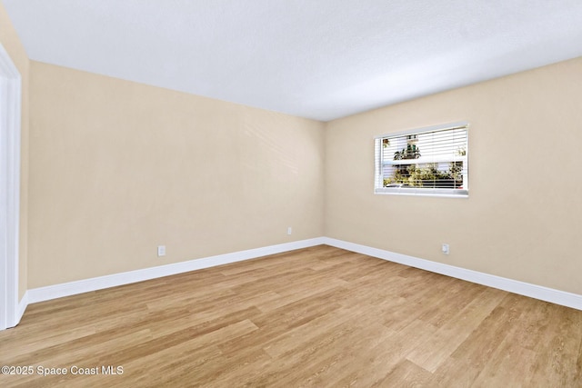 unfurnished room featuring light wood-type flooring