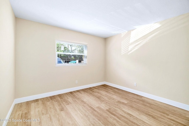 230 Columbia Dr Unit 113, Cape Canaveral, FL 32920 - empty room featuring wood finished floors and baseboards