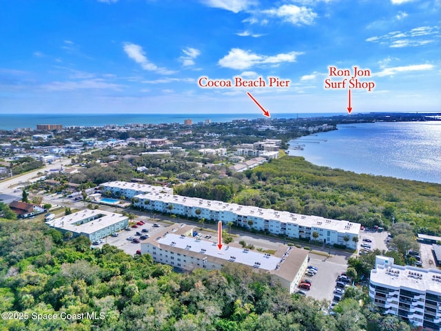 230 Columbia Dr Unit 113, Cape Canaveral, FL 32920 - drone / aerial view of a nearby body of water and apartment complex